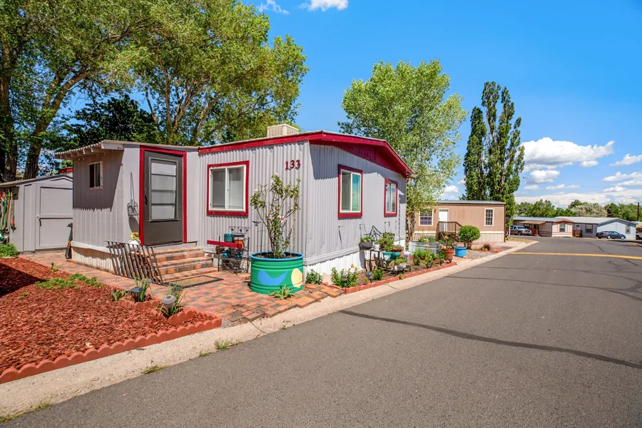 A landscaped resident home on a Colony street