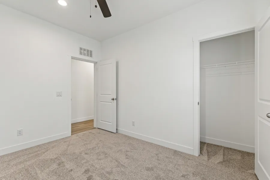 Second bedroom with carpet